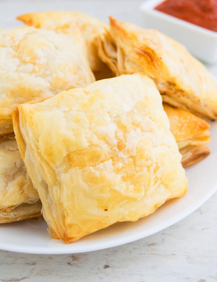 Chicken Parcels or Patties on White Plate. 