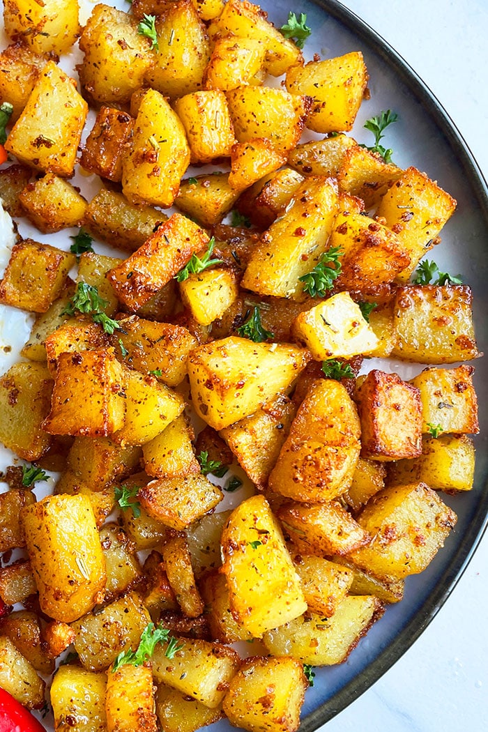 Easy Crispy Breakfast Potatoes in Navy Blue Plate- Overhead Shot