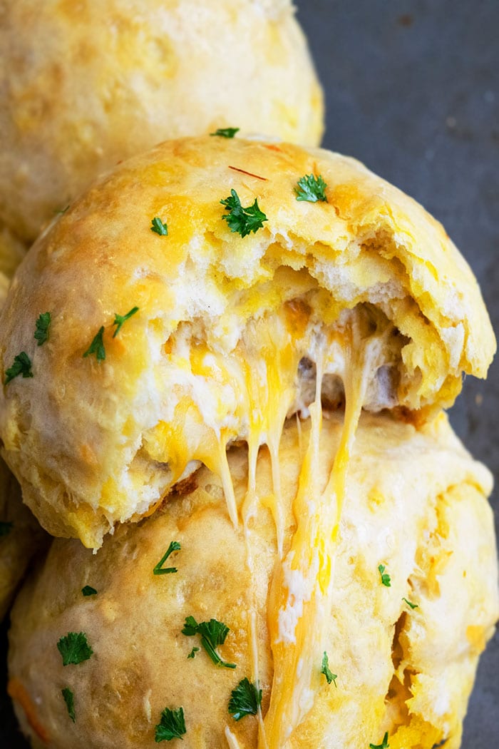 Closeup Shot of Biscuits Stuffed with Cheese- Partial Bite Removed