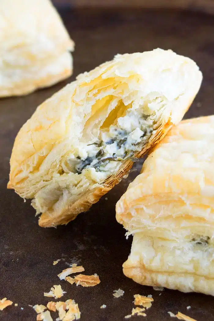 Easy Homemade Spinach Puffs with Cheese and Italian Herbs, Placed on Rustic Black Tray