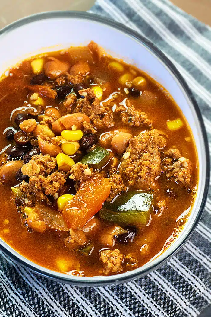 Easy Homemade Mexican Taco Soup in White Bowl- Overhead Shot