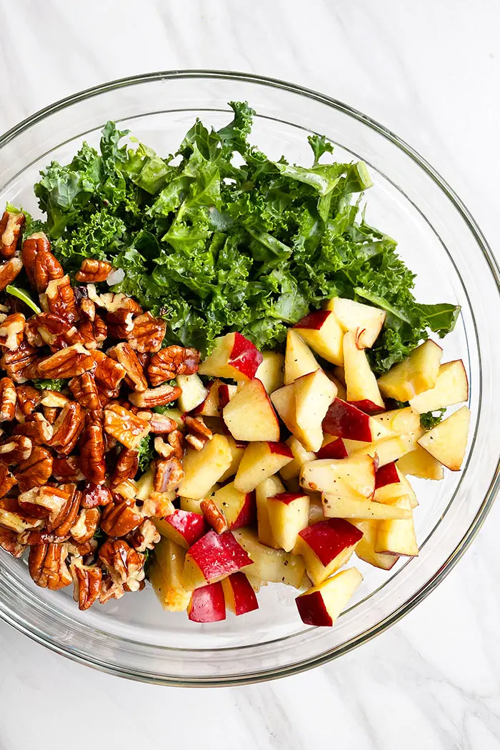 Salad Ingredients in Glass Bowl on Marble Background- Overhead Shot