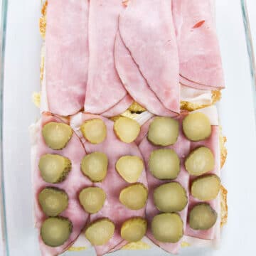 Pickles placed on top of the meat.