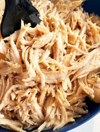 Easy Juicy Instant Pot Shredded Chicken Served in Blue Bowl