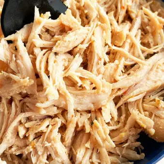 Easy Juicy Instant Pot Shredded Chicken Served in Blue Bowl