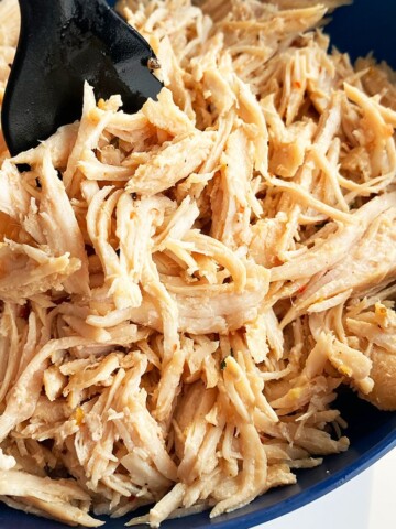 Easy Juicy Instant Pot Shredded Chicken Served in Blue Bowl