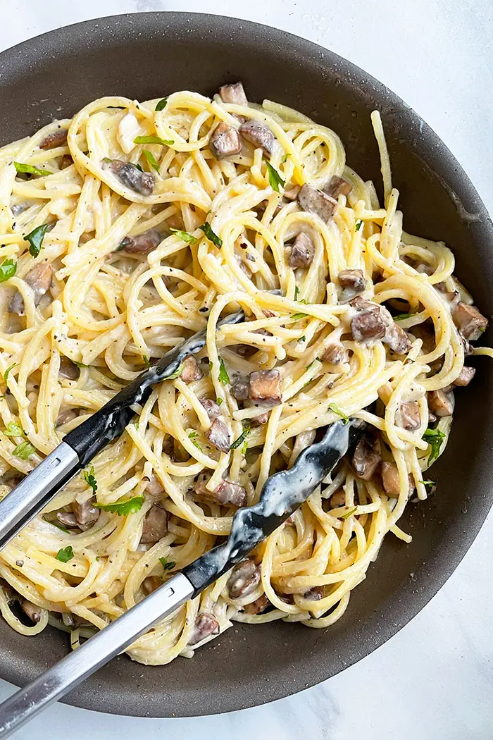 Creamy Mushroom Pasta in Nonstick Pot with Tongs