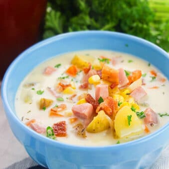 Easy Homemade Instant Pot Corn Chowder with Ham, Bacon and Potatoes, Served in Blue Bowl