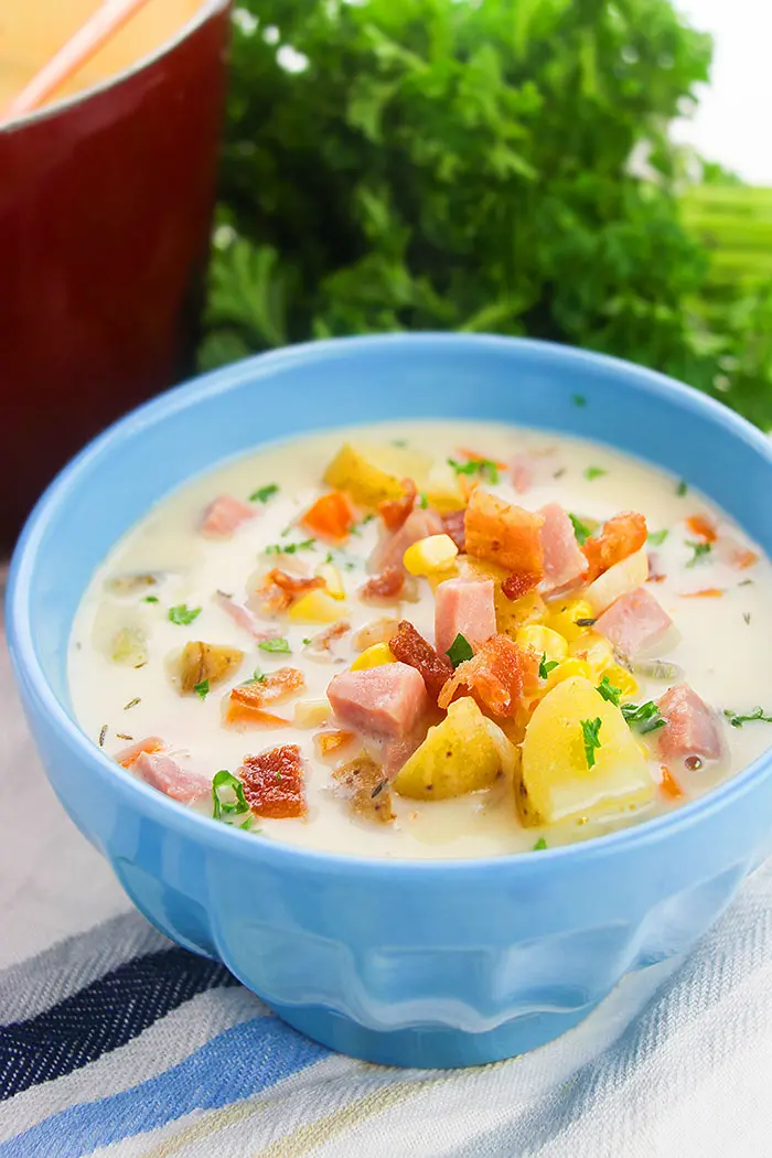Instant Pot Corn Chowder with Ham, Bacon and Potatoes, Served in Blue Bowl