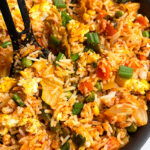 Easy Homemade Kimchi Fried Rice in Black Nonstick Pan With Black Spoon