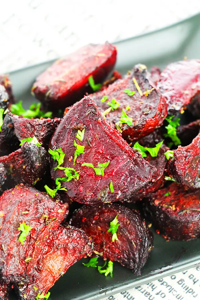 Easy Oven Roasted Beets in Black Plate with Parsley Garnish