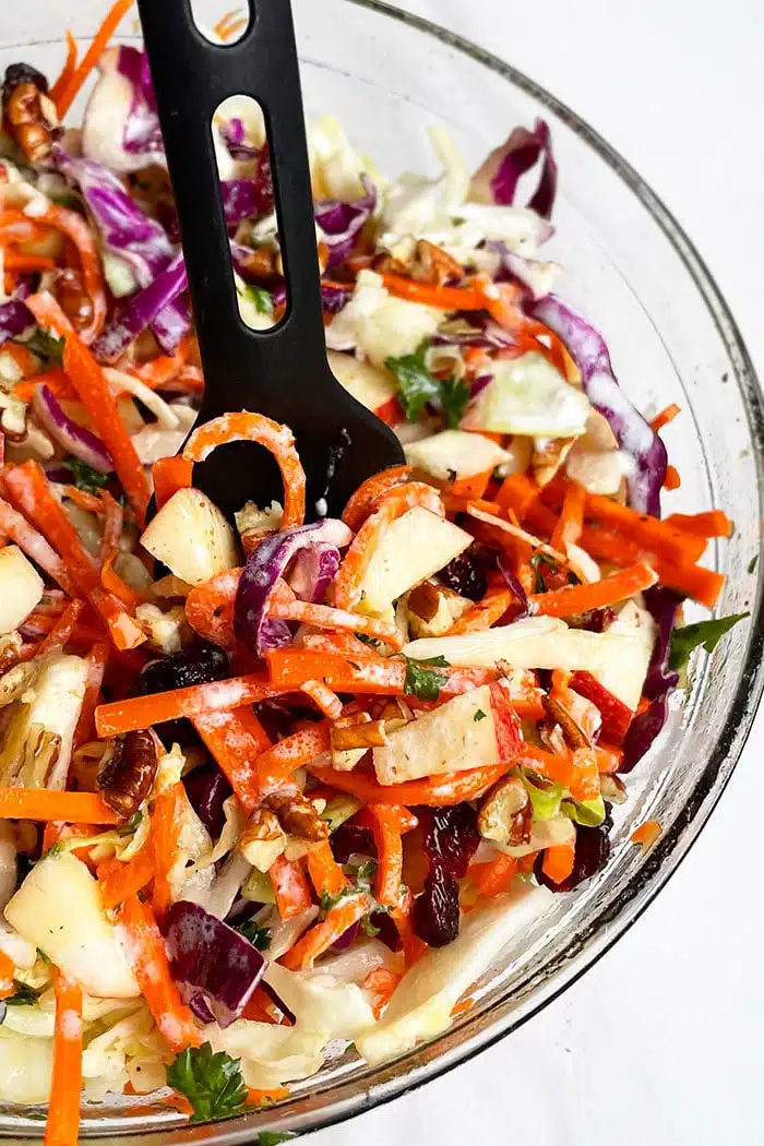 Easy Apple Coleslaw in Glass Bowl on White Background