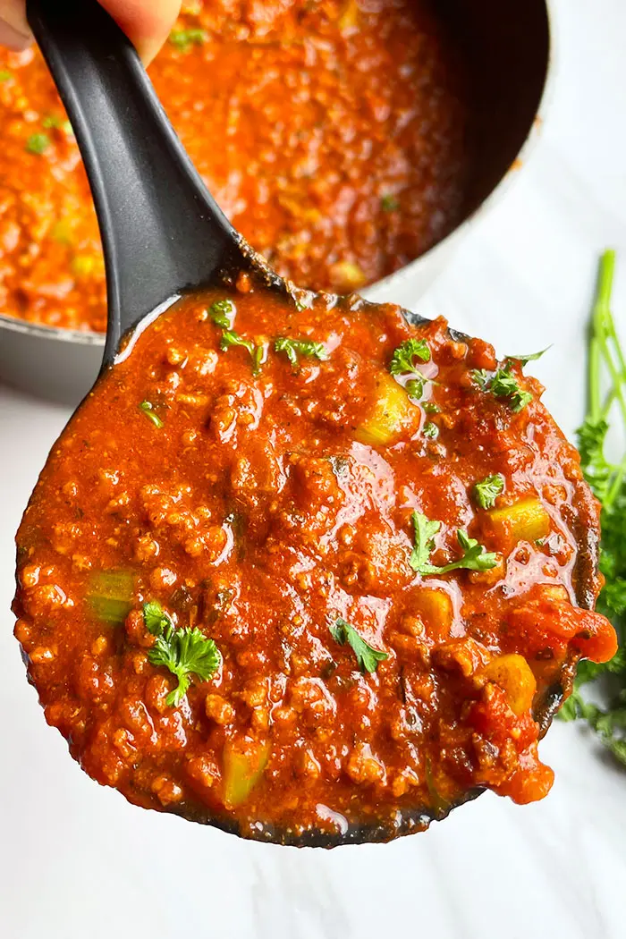 Spoonful of Best Beef Bolognese Sauce on White Background