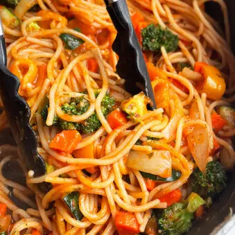 Easy Vegetable Pasta Prepared in Instant Pot and Served in Black Pot With Tongs