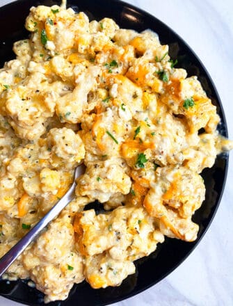 Easy Instant Pot Cheesy Cauliflower Served in Black Plate