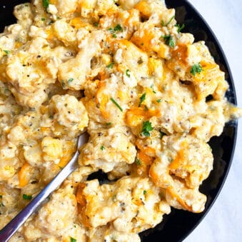 Easy Instant Pot Cheesy Cauliflower Served in Black Plate