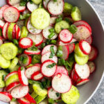 Easy Cucumber Radish Salad in Gray Bowl on Rustic Gray Background