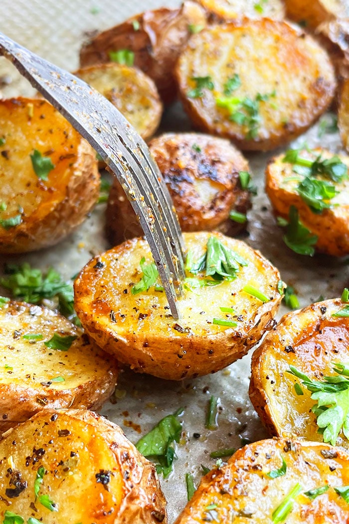 Fork Full of Easy Roasted Baby Potatoes With Italian Herbs- Closeup Shot