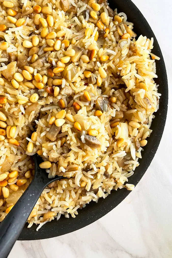 Vegetarian Rice Pilaf in Black Pot With Black Spoon- Overhead Shot