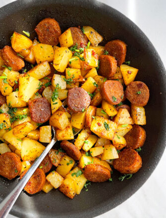 Easy Sausage and Potatoes Made in Instant Pot and Served in Black Dish