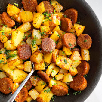 Easy Sausage and Potatoes Made in Instant Pot and Served in Black Dish