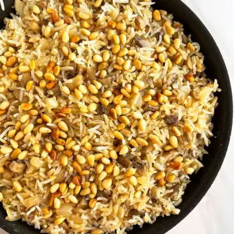 Easy Mushroom Rice in Black Pot on White Background