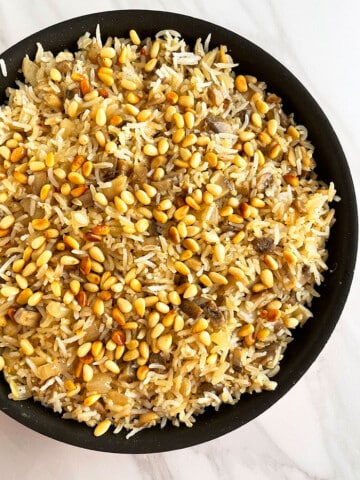 Easy Mushroom Rice in Black Pot on White Background