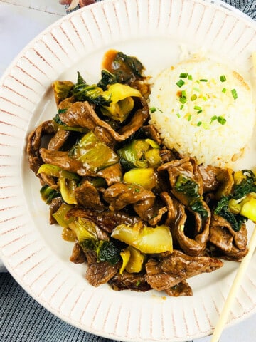 Easy Instant Pot Ginger Beef Served in White Plate With Steamed Rice- Overhead Shot