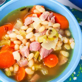 Easy Instant Pot Leftover Ham Bone Soup Served in Blue Bowl