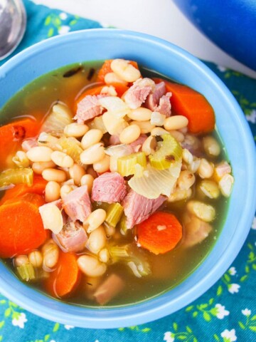 Easy Instant Pot Leftover Ham Bone Soup Served in Blue Bowl