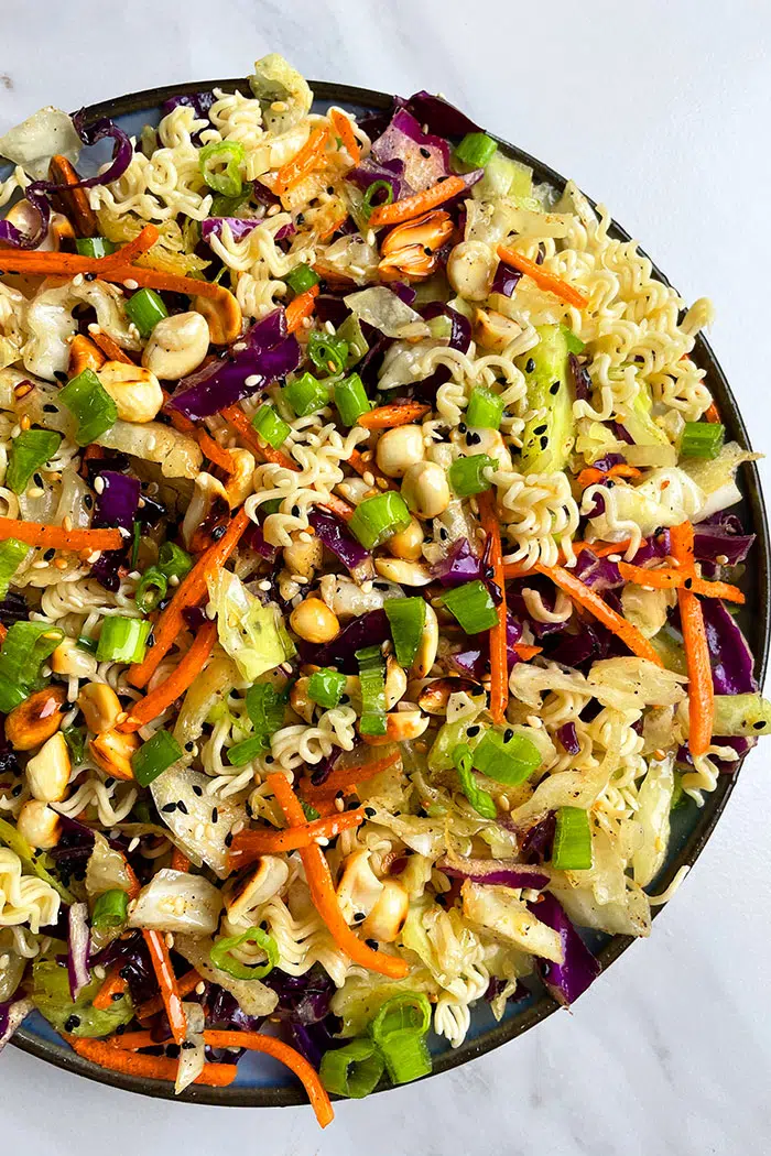 Easy Chinese Ramen Noodle Salad in Black Dish on White Background