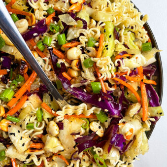 Easy Asian Ramen Noodle Salad in Black Dish on White Background