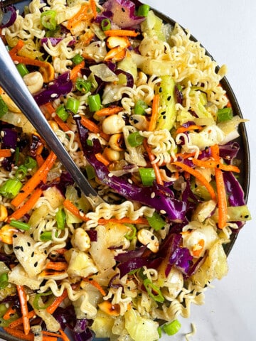 Easy Asian Ramen Noodle Salad in Black Dish on White Background