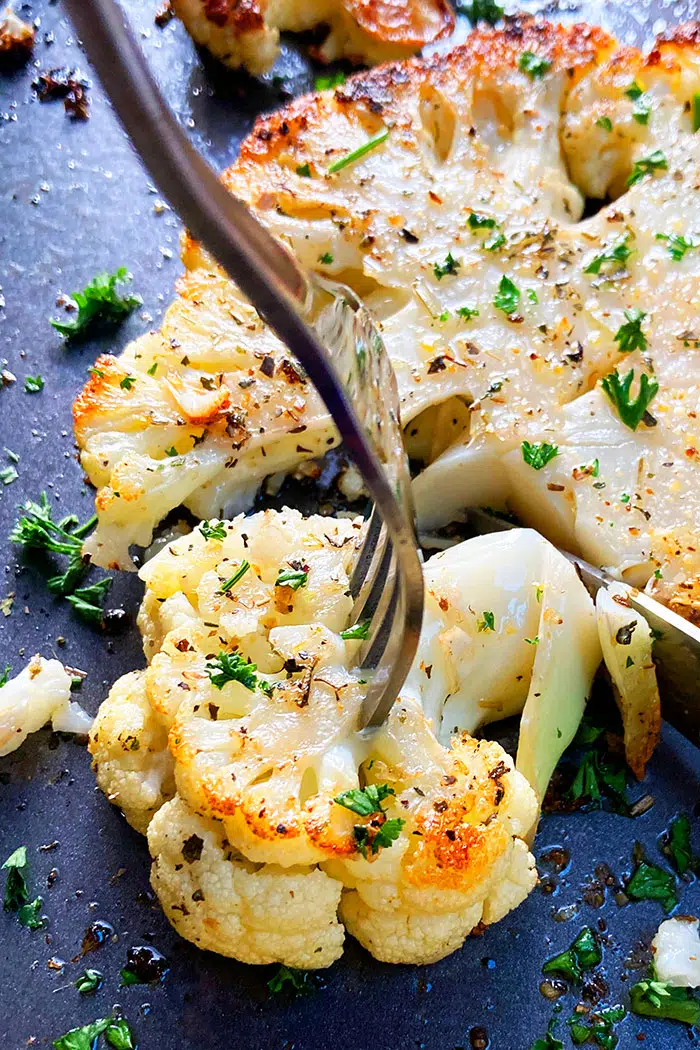 Fork Full of an Oven Baked Cauliflower Floret- Closeup Shot