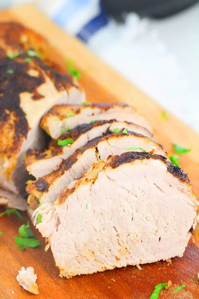 Slices of Easy Instant Pot Pork Tenderloin Served on Wooden Cutting Board 