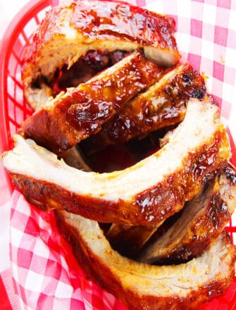 Easy Sticky Tender Fall off The Bone Instant Pot BBQ Ribs Served in Red Dish