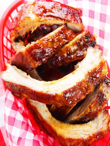 Easy Sticky Tender Fall off The Bone Instant Pot BBQ Ribs Served in Red Dish