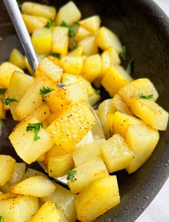 Easy Stovetop Crispy Sauteed Potatoes With Garlic and Lemon Pepper in Black Nonstick Pan