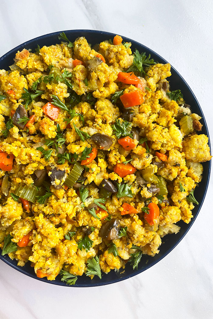 Easy Cornbread Stuffing in Blue Bowl on White Background