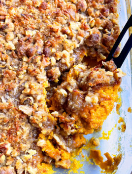 Easy Fluffy Sweet Potato Casserole With Crumbled Butter Pecan Brown Sugar Topping in Glass Dish