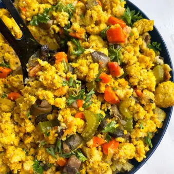 Easy Homemade Vegetarian Cornbread Stuffing or Dressing in Blue Bowl on White Background