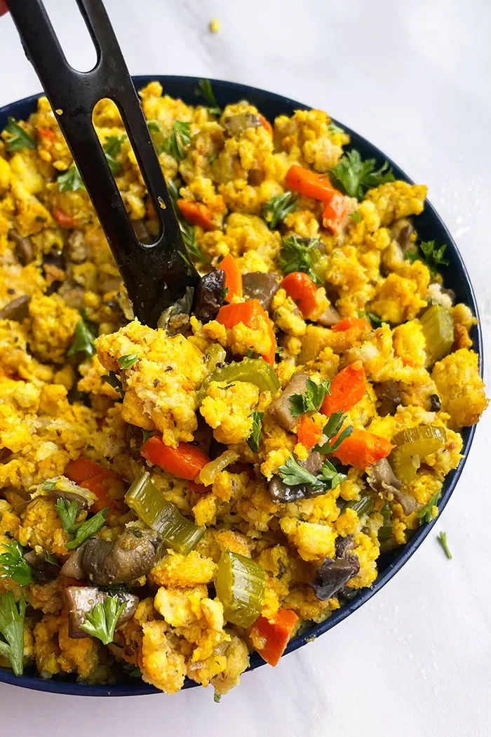 Blue Bowl Full of Thanksgiving Stuffing With Mushrooms and Vegetables