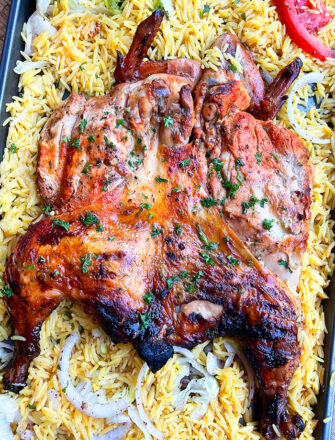 Juicy Easy Oven Baked Spatchcock Chicken on a Large Tray With Rice- Overhead Shot