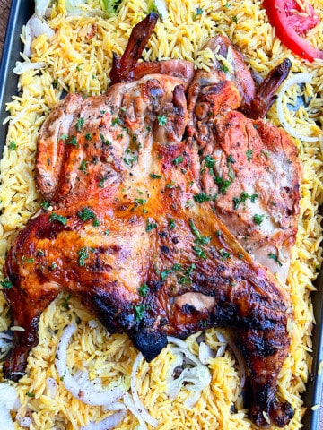 Juicy Easy Oven Baked Spatchcock Chicken on a Large Tray With Rice- Overhead Shot