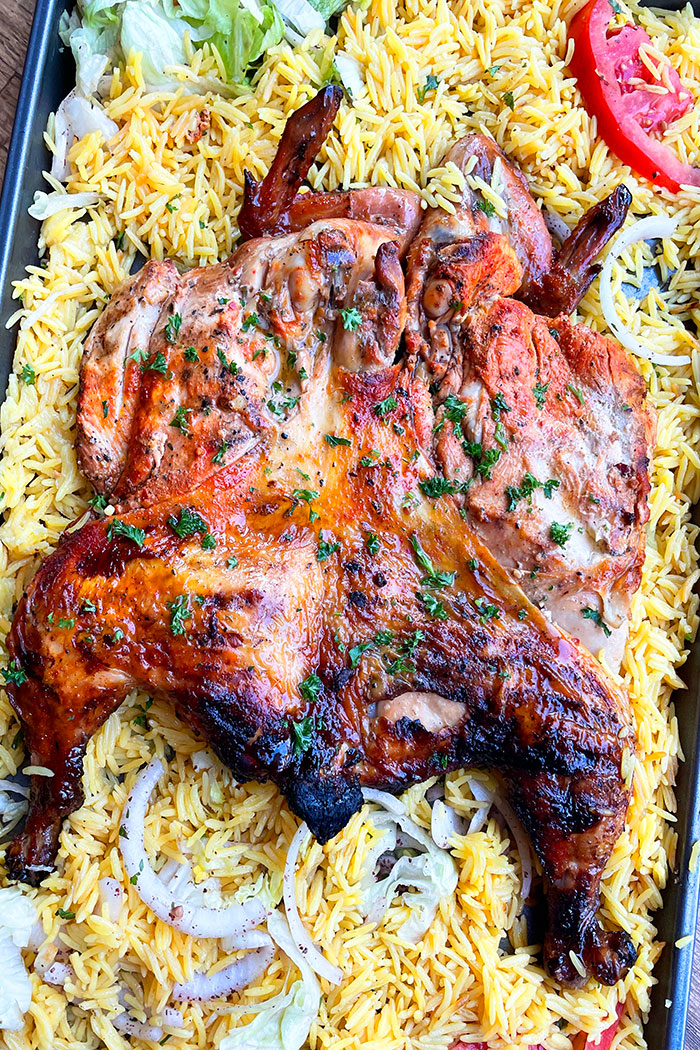 Juicy Easy Oven Baked Spatchcock Chicken on a Large Tray With Rice- Overhead Shot