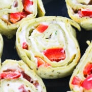 Closeup Shot of Pinwheel Sandwiches (Roll ups) Stuffed With Ranch Cream Cheese and Peppers.