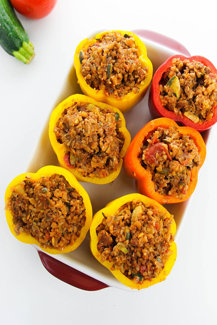 Stuffed Peppers With Rice and Ground Beef in White Casserole Dish