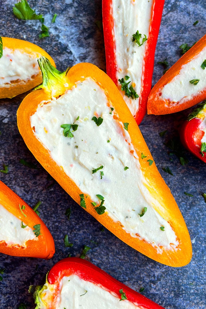 Closeup Shot of Cream Cheese Stuffed Mini Peppers on Rustic Gray Background