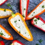 Easy One Pan Cream Cheese Stuffed Mini Peppers (Sweet Peppers) on Rustic Gray Background.