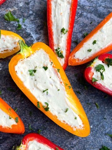 Easy One Pan Cream Cheese Stuffed Mini Peppers (Sweet Peppers) on Rustic Gray Background.